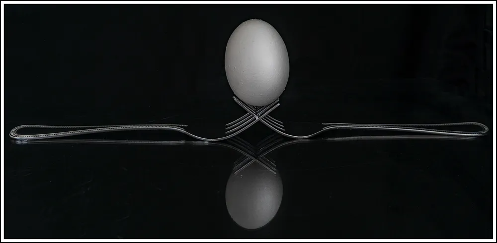 egg balancing on forks example Photographing the mundane at home